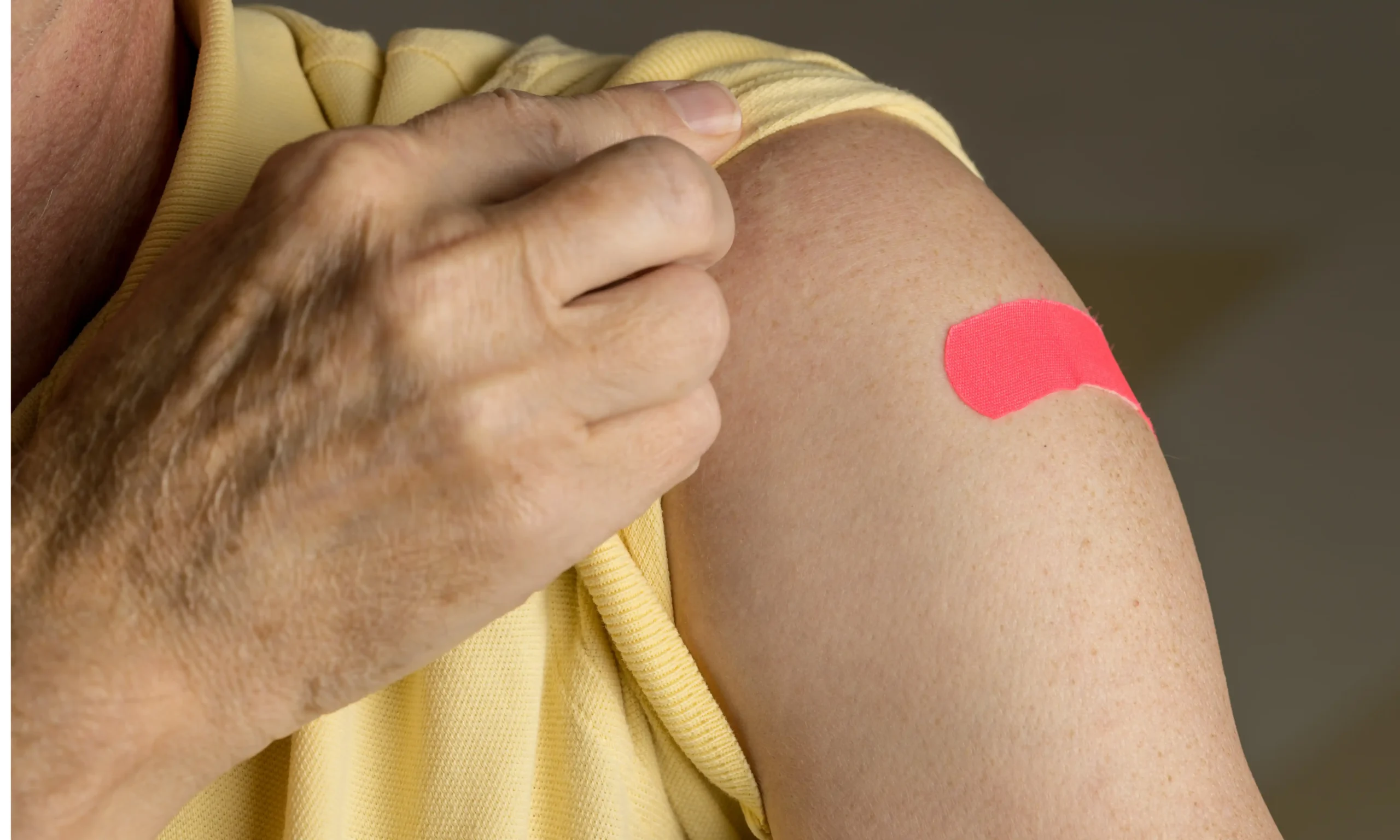 A person with a pink color bandaid