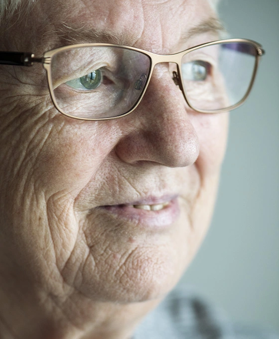 Closeup of an elderly woman wearing glasses