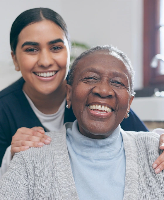 Caregiver and client smiling for the camera