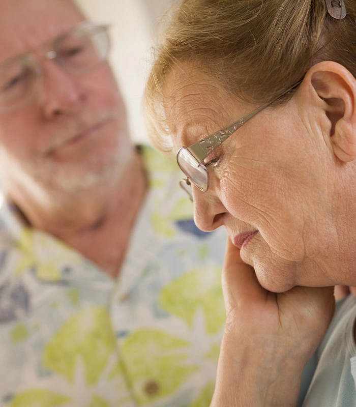 Woman with dementia with husband looking worried
