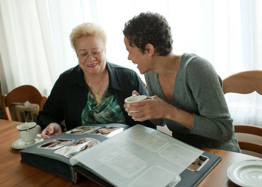 Two women looking at photos
