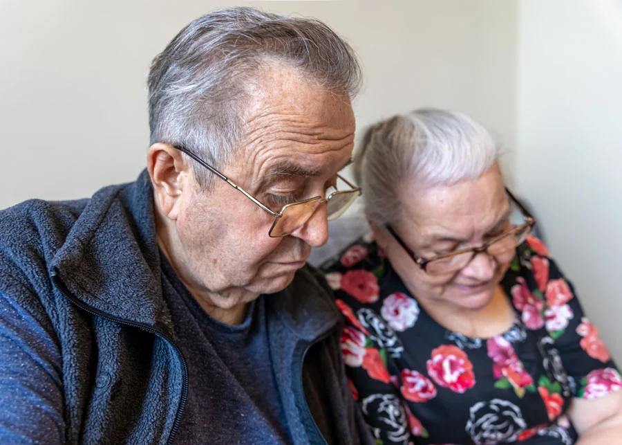 Senior couple reading together