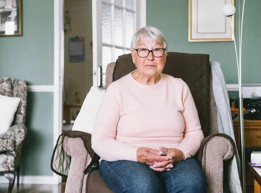 Senior woman sitting in recliner