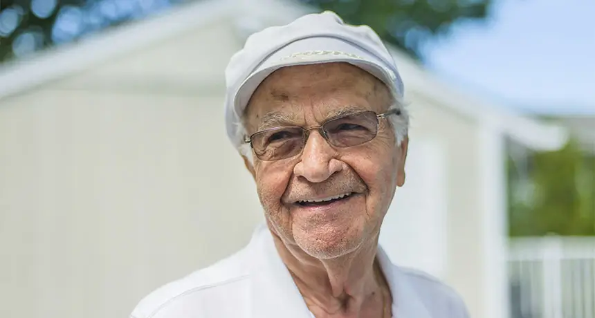 Closeup of senior man standing outside